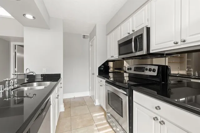 a view of a hallway with washer and dryer