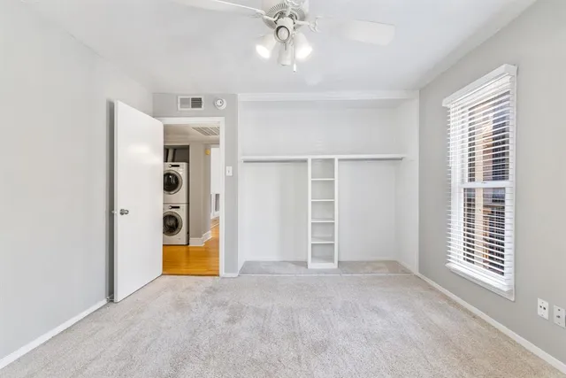 a bathroom with a sink toilet vanity and shower