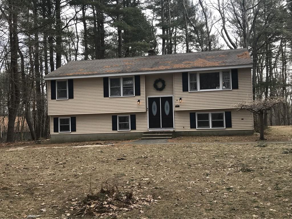 4 Bethany Drive Rutland, MA 01543 - Photo 1 of 22 a front view of a house with a garden