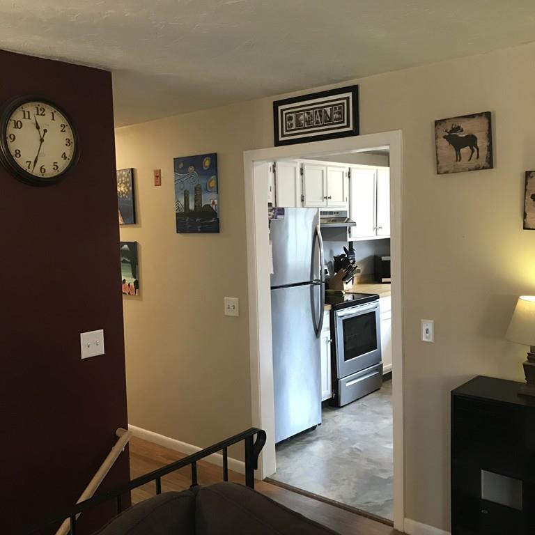 4 Bethany Drive Rutland, MA 01543 - Photo 8 of 22 a kitchen with a refrigerator and a stove