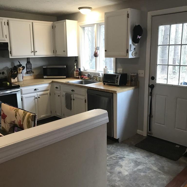 4 Bethany Drive Rutland, MA 01543 - Photo 9 of 22 a kitchen with cabinets appliances and a window
