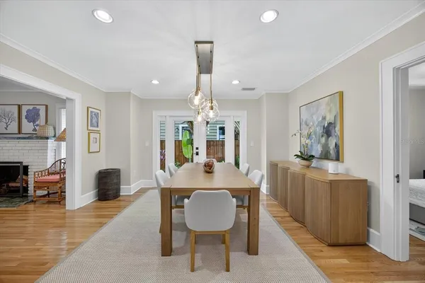 a kitchen with stainless steel appliances kitchen island granite countertop a refrigerator and a stove top oven