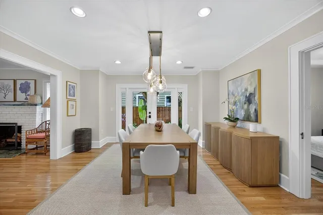 a kitchen with stainless steel appliances kitchen island granite countertop a refrigerator and a stove top oven