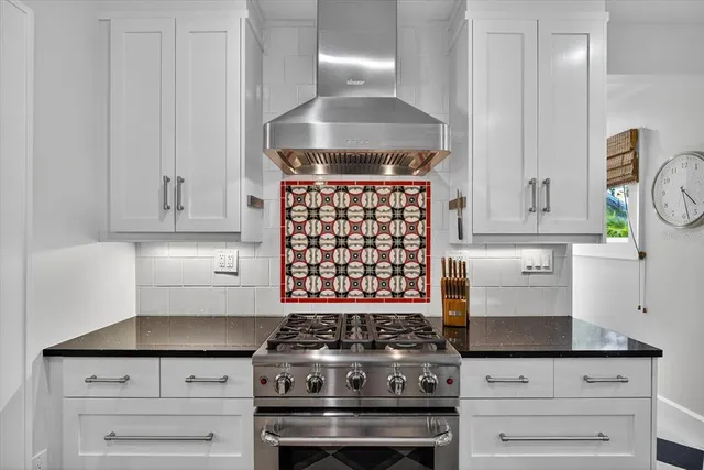 a bedroom with a bed dresser and a window