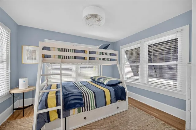 a view of a livingroom with furniture and a flat screen tv