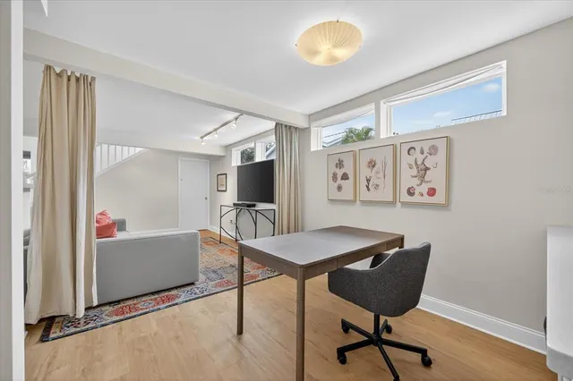 a living room with furniture or couch and a dining table