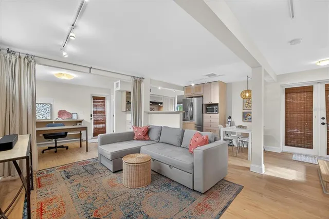 a kitchen with stainless steel appliances a refrigerator stove and microwave