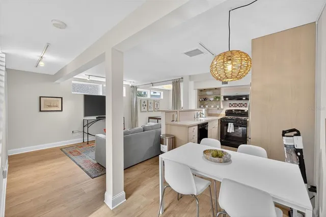 a kitchen with stainless steel appliances granite countertop a refrigerator and a stove