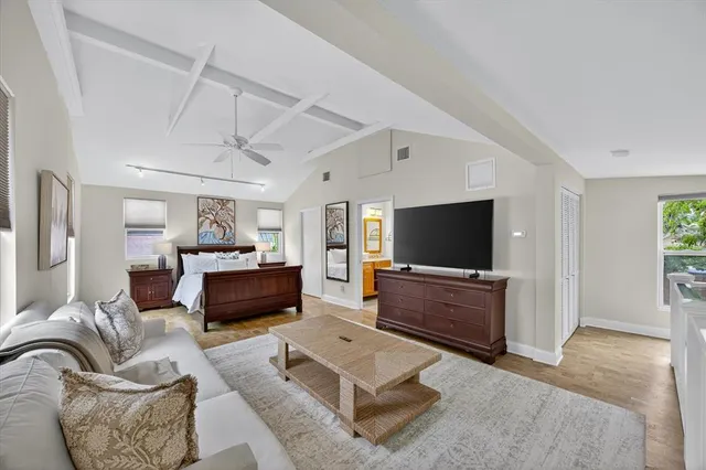 a spacious bathroom with a toilet sink and mirror