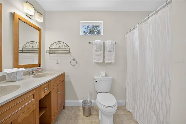 a view of a chairs and table in backyard of the house