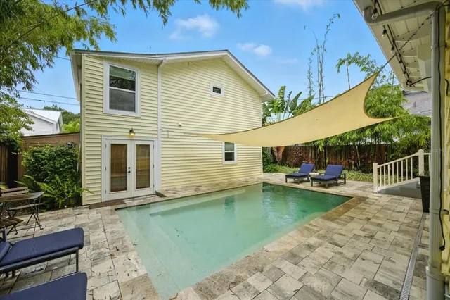 a view of a backyard with sitting area