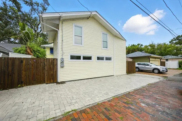 an aerial view of residential houses with city view