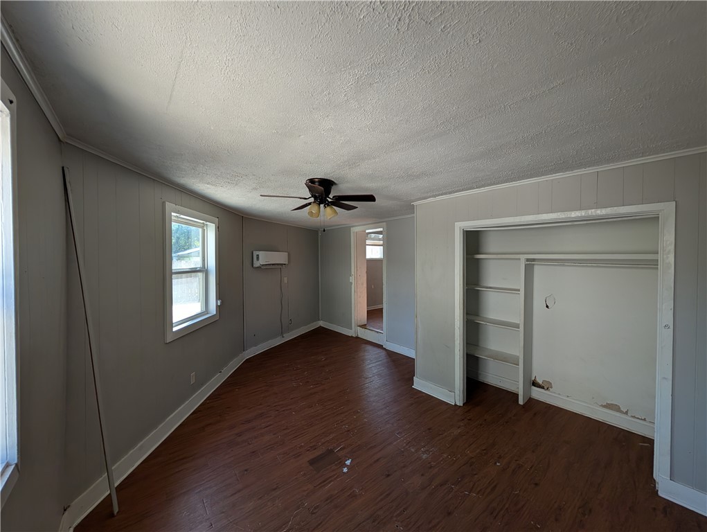 4104 Marsh Street Bryan, TX 77803 - Photo 14 of 17 an empty room with wooden floor and windows