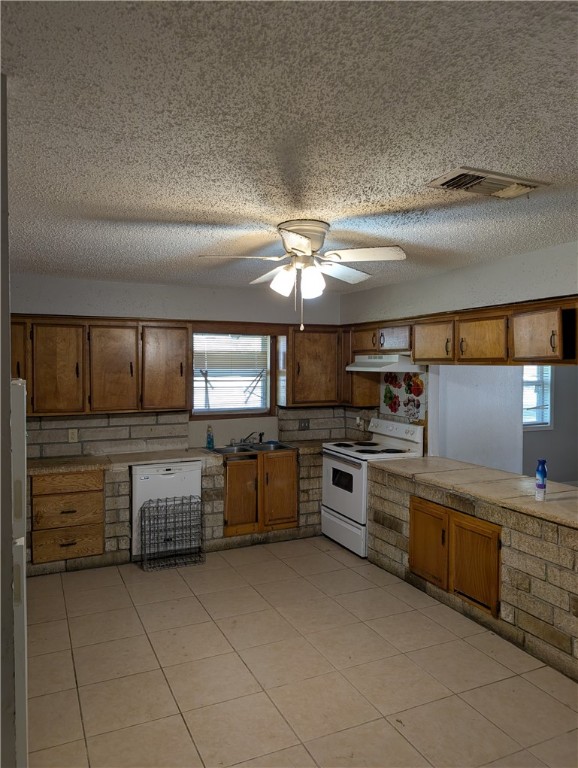 4104 Marsh Street Bryan, TX 77803 - Photo 6 of 17 a kitchen with cabinets a sink and appliances