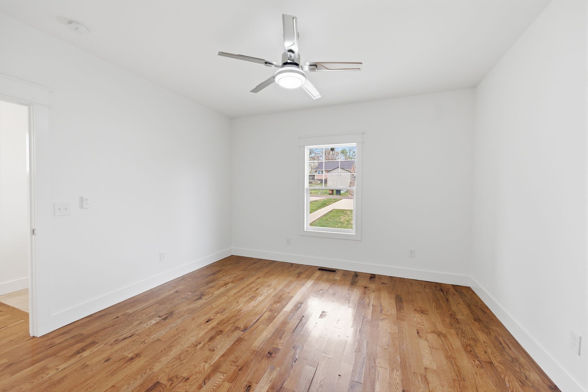 1332 B Lischey Avenue Nashville, TN 37207 - Photo 15 of 43 an empty room with a window and wooden floor