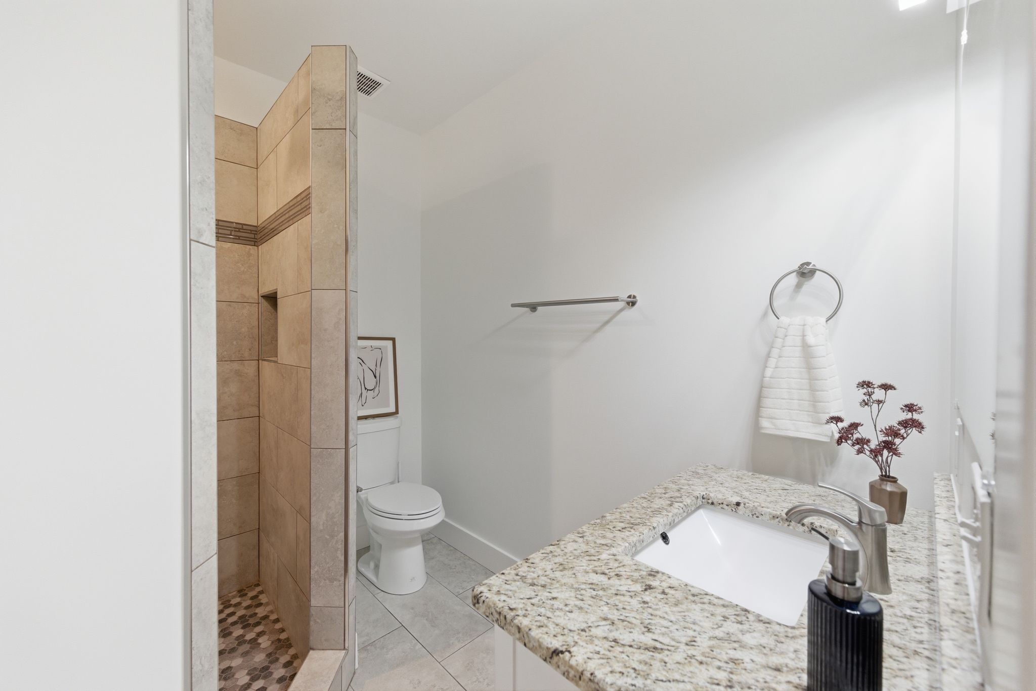1332 B Lischey Avenue Nashville, TN 37207 - Photo 17 of 43 a bathroom with a granite countertop sink a toilet and shower