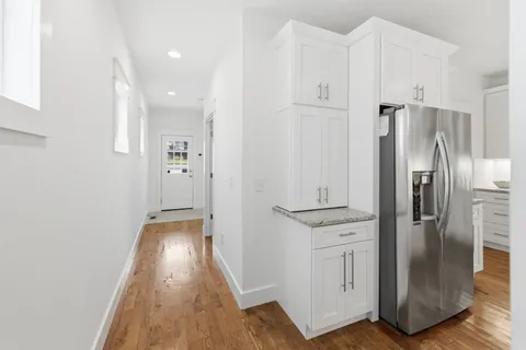 a kitchen with cabinets and stainless steel appliances