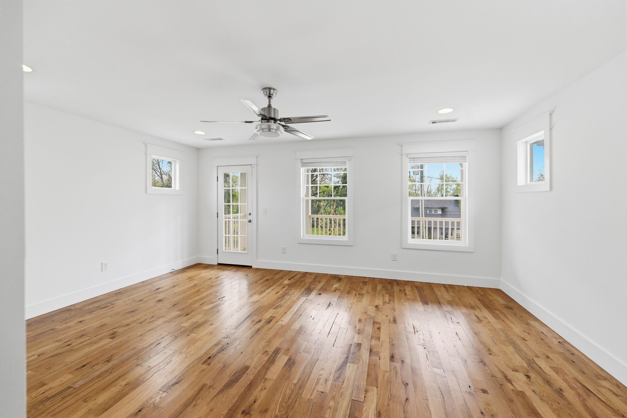 1332 B Lischey Avenue Nashville, TN 37207 - Photo 22 of 43 a view of an empty room with wooden floor and a window