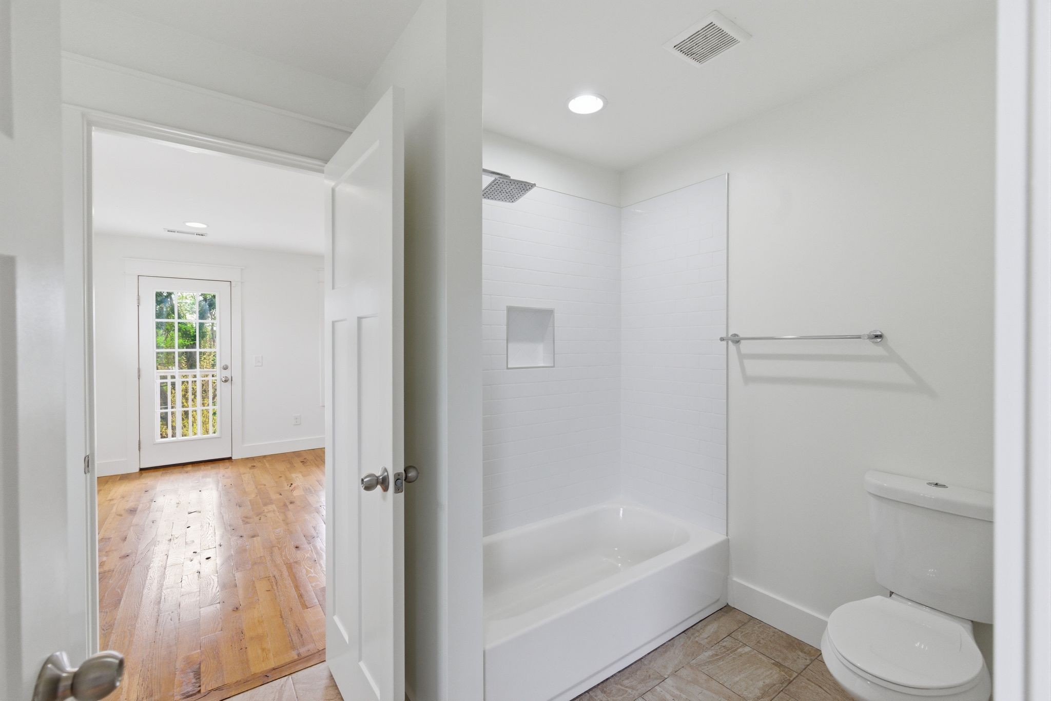 1332 B Lischey Avenue Nashville, TN 37207 - Photo 27 of 43 a bathroom with a granite countertop bathtub shower sink vanity and toilet