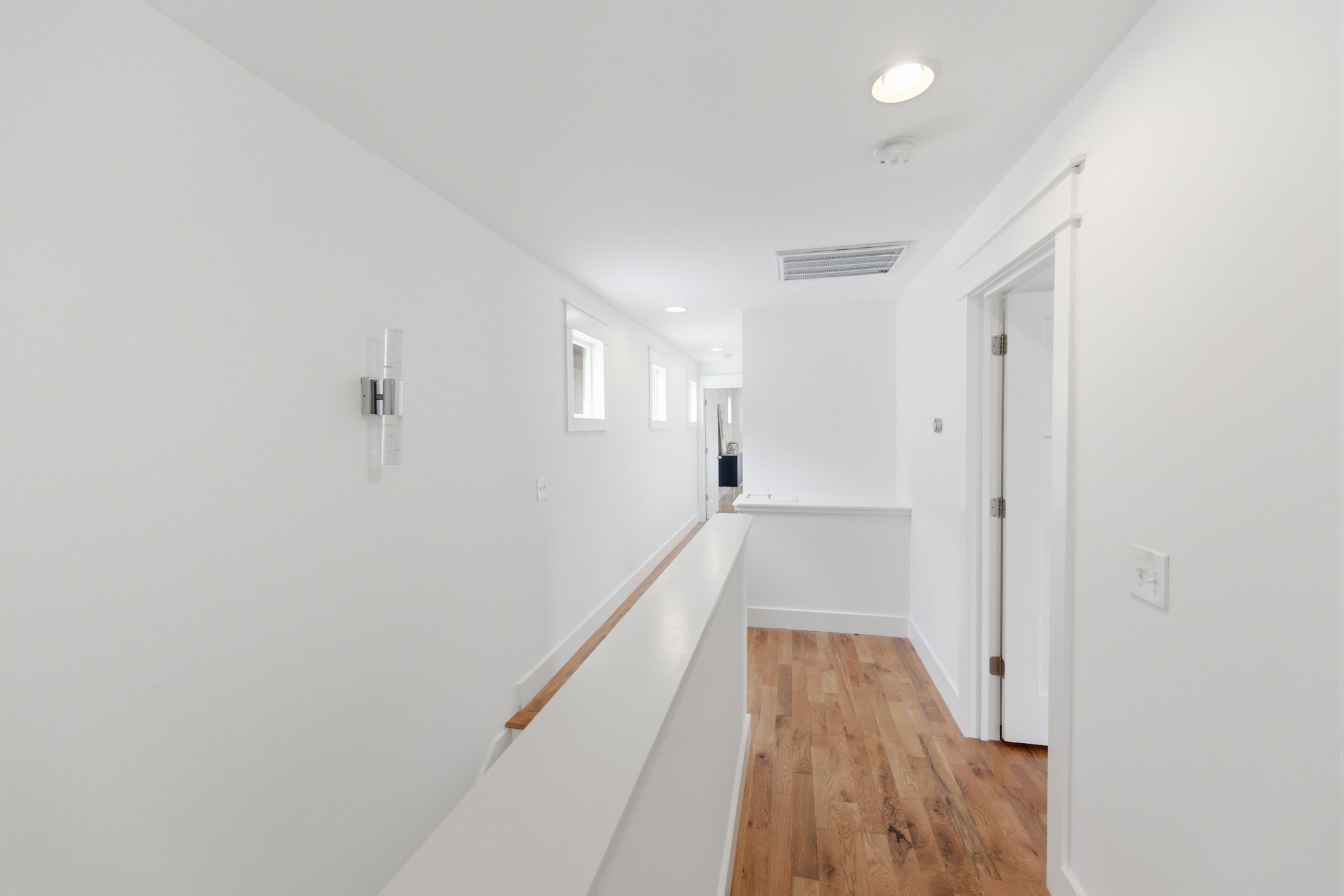 1332 B Lischey Avenue Nashville, TN 37207 - Photo 30 of 43 a view of a hallway with wooden floor and staircase