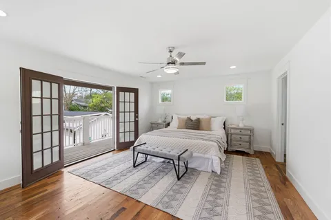 a spacious bedroom with a large bed and a window