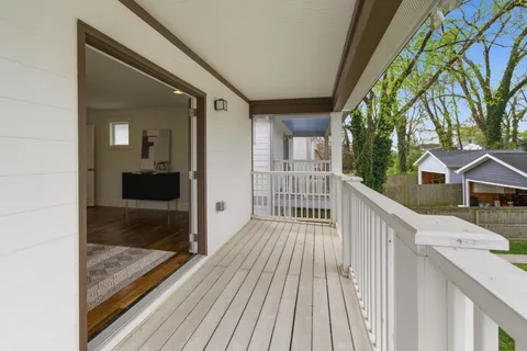 a view of a balcony with wooden floor