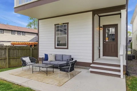 a outdoor space with a couch and chairs
