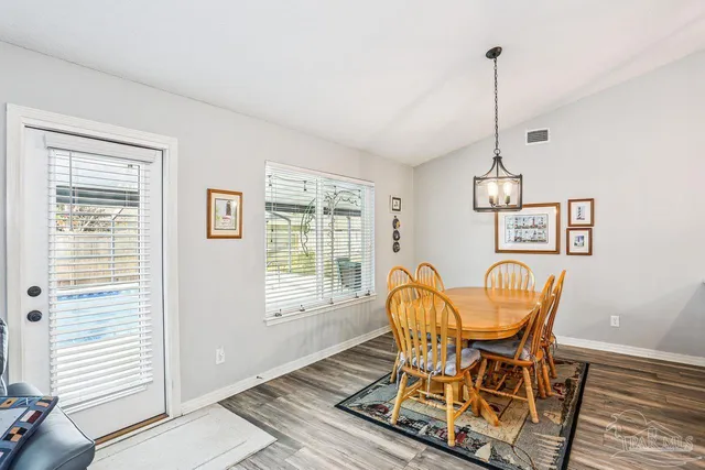 a patio with table and chairs