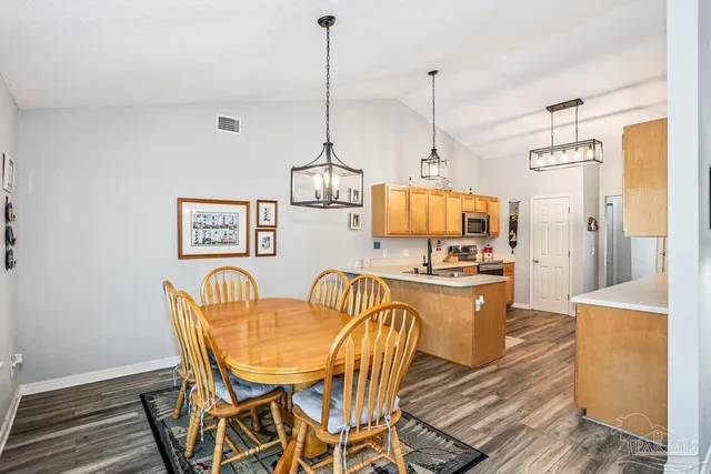 a view of kitchen and dining area with furniture