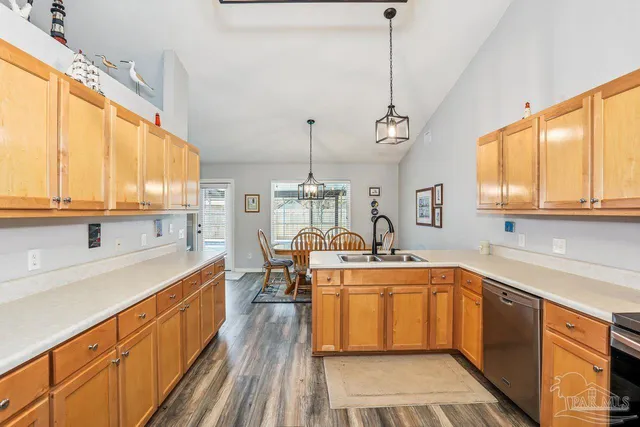 a large white kitchen with a large window