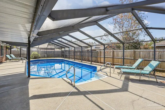 a view of a swimming pool with a lounge chairs