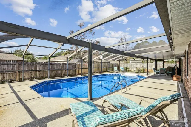 a view of a patio with a table and chairs