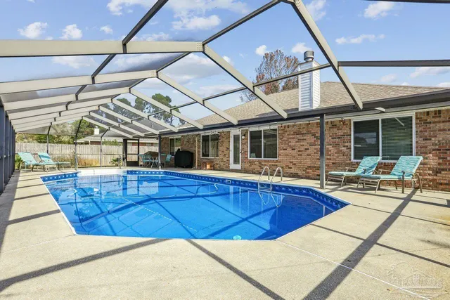 a view of a patio with a table and chairs