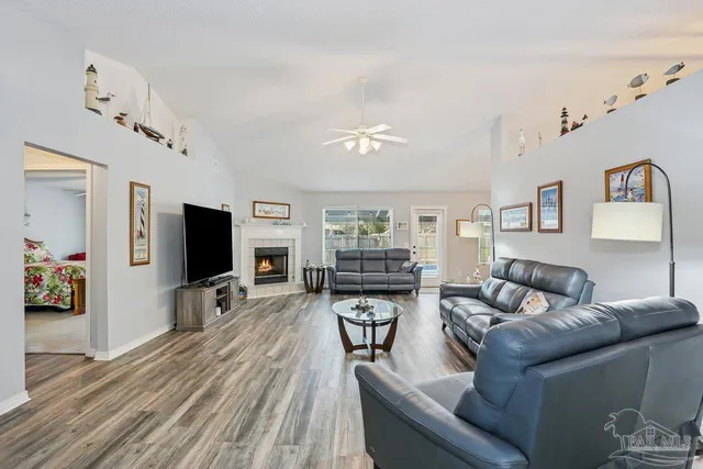 a living room with furniture and a flat screen tv