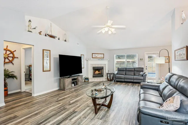 a living room with furniture and a flat screen tv