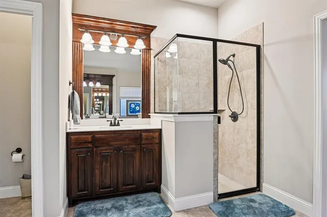 a bathroom with a sink vanity and a mirror