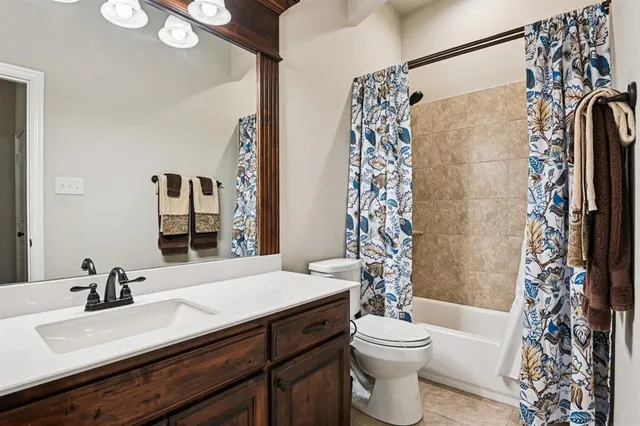a bathroom with a sink vanity and a mirror