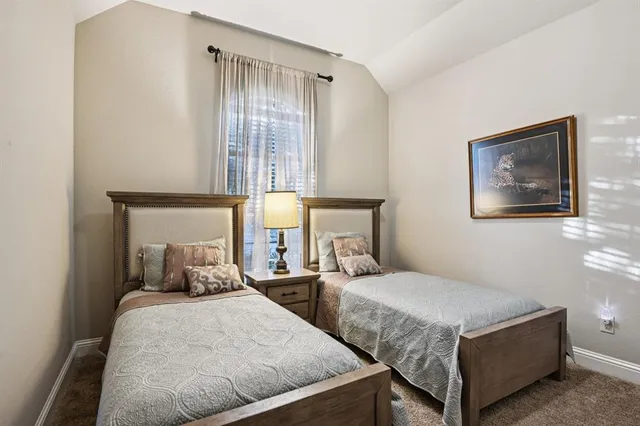 a bedroom with a bed and a mirror