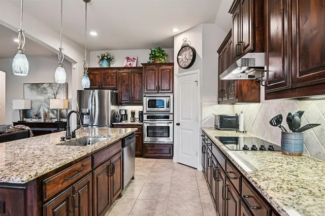 a kitchen with sink cabinets and outdoor space