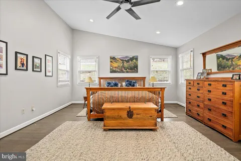a bedroom with bed and a window