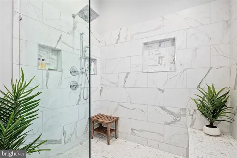 a bathroom with a sink vanity and mirror