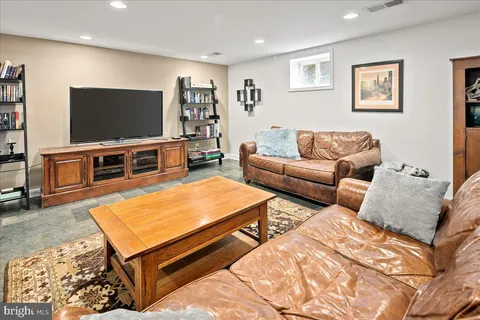 a living room with a table tennis table and table