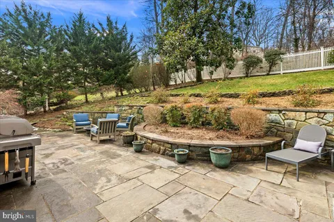a view of a backyard with sitting area