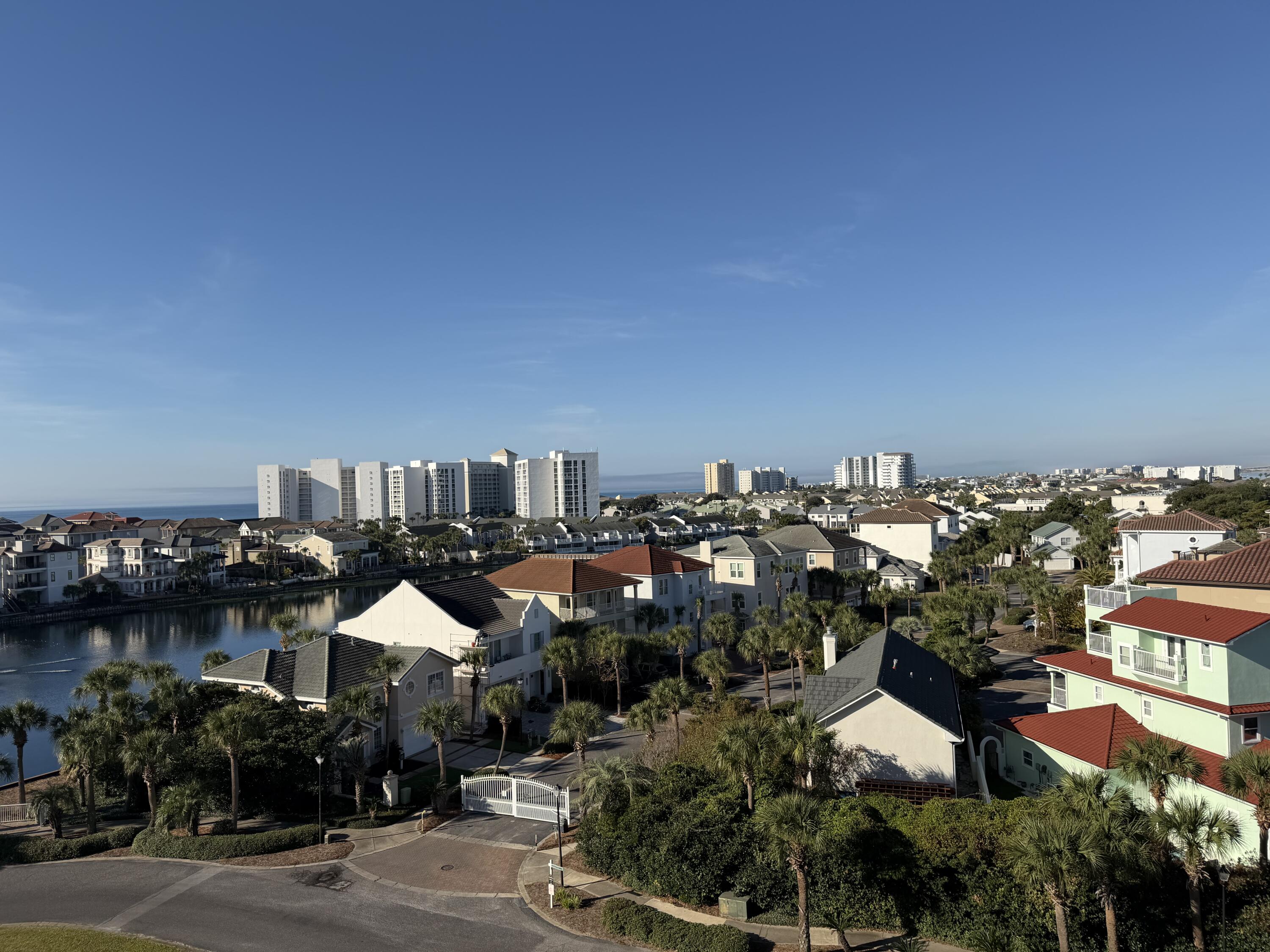 970 Highway 98, Unit 602 Destin, FL 32541 - Photo 15 of 18 an aerial view of a house with a garden and lake view