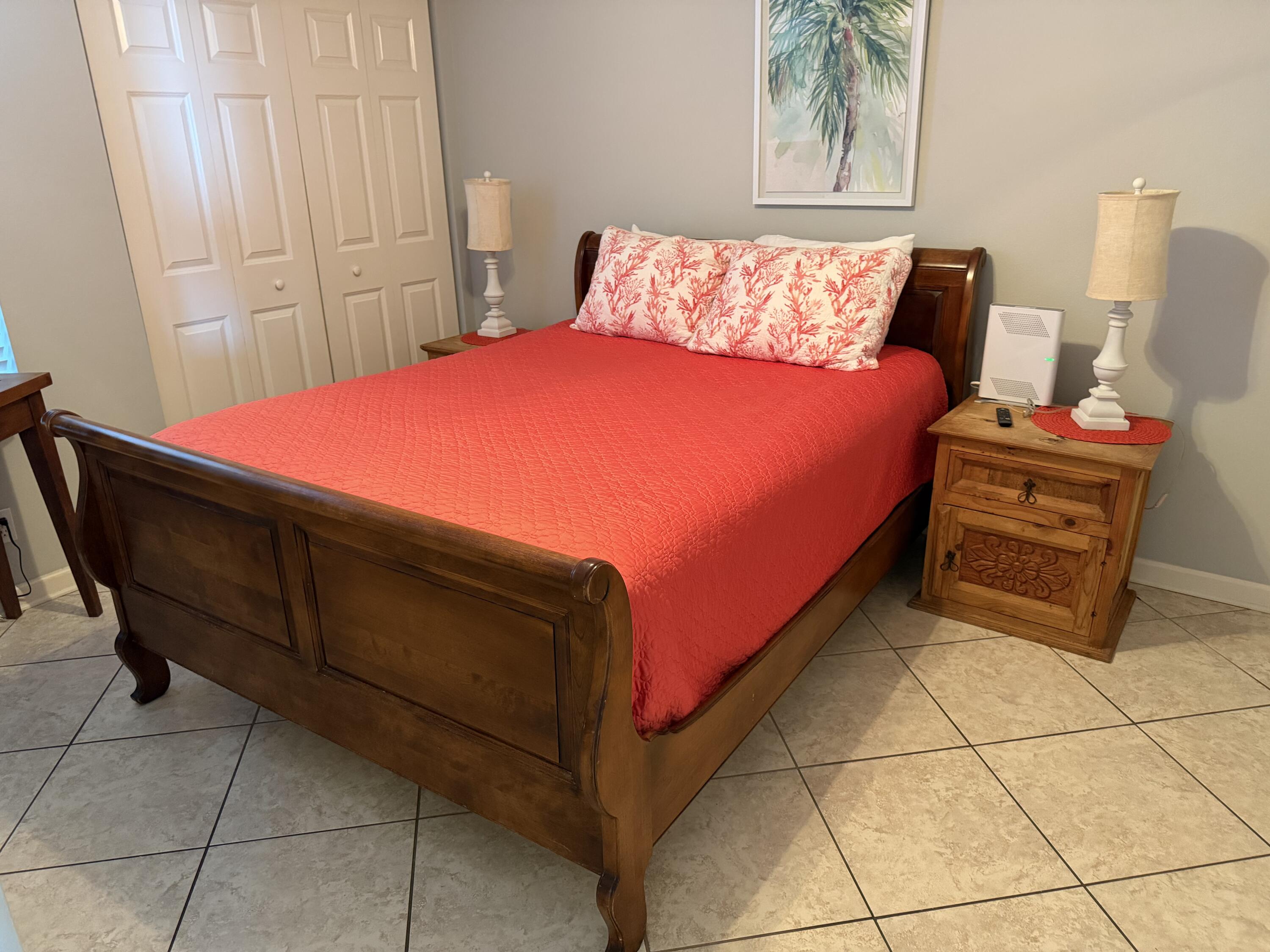 970 Highway 98, Unit 602 Destin, FL 32541 - Photo 9 of 18 a bed room with a bed and a chair