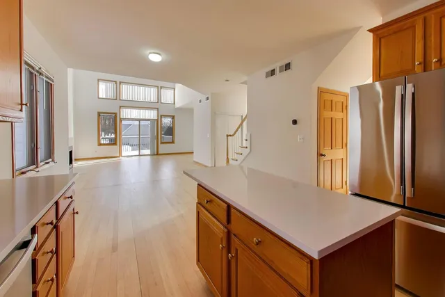 a kitchen with stainless steel appliances a refrigerator and a stove