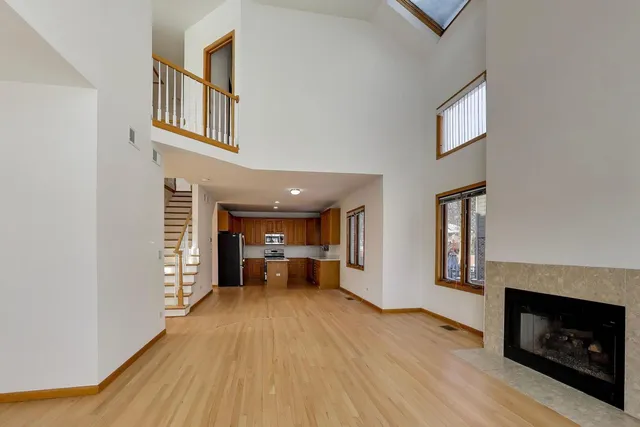 a view of living room with furniture and fireplace