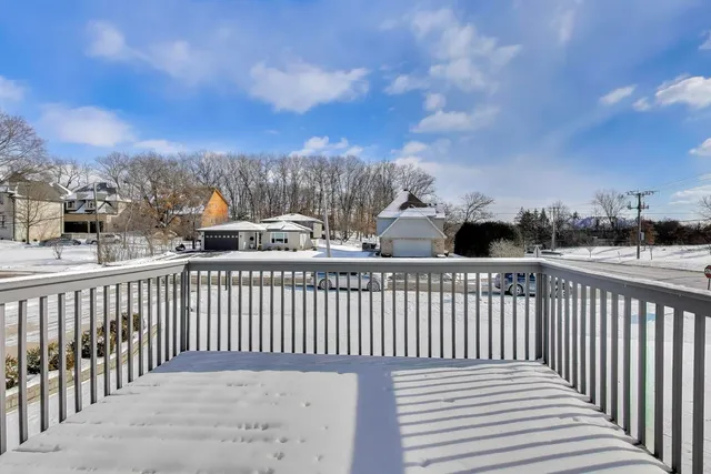 a view of a balcony with wooden fence