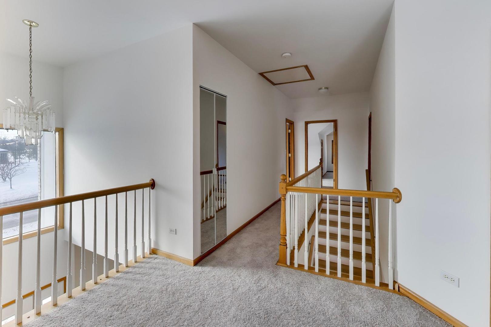 16W234 91st Street Burr Ridge, IL 60527 - Photo 21 of 50 a view of a hallway with windows