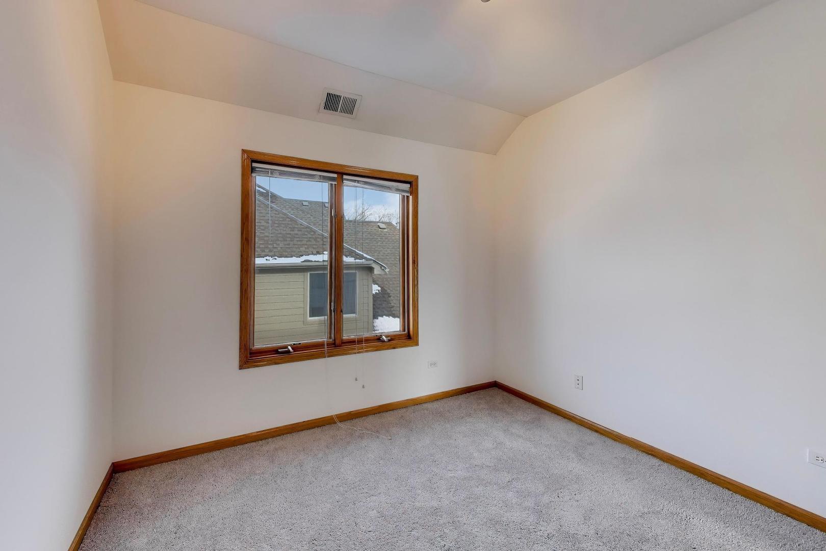 16W234 91st Street Burr Ridge, IL 60527 - Photo 38 of 50 an empty room with a window